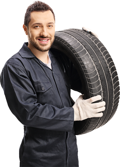 Mechanic holding a car tire